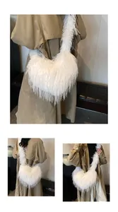 Detailed view of a white faux fur heart-shaped tote bag with fluffy feather texture
