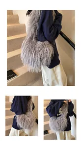 Detail view of a large grey faux fur tote bag showing the fluffy feather-like texture on model