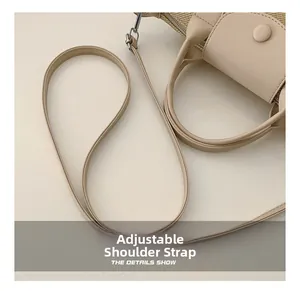 Detail of adjustable shoulder strap and premium woven texture on cream dumpling bag