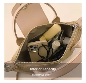 Internal capacity of minimalist tote bag showing phone, glasses and cosmetics storage