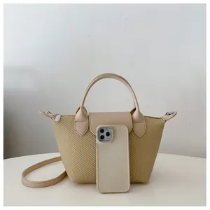 Detail shot of a woven dumpling bag with light beige leather straps and size comparison