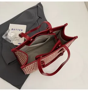 Interior view of red houndstooth tote bag with central zipper and spacious compartments