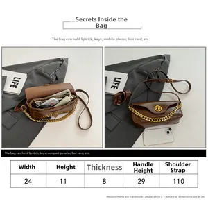 Size chart for brown leather underarm bag showing dimensions in centimeters