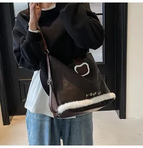 Detail of dark brown tote bag featuring white plush trim and LUCKYDAY embroidery