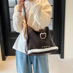 Vintage brown tote bag with faux fur trim and Lucky Day text worn on shoulder