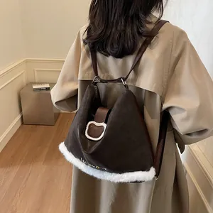 Vintage brown and white leather backpack with plush trim and cute bear patch detail