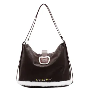 Brown tote bag with white plush trim and bear patch shown on white background