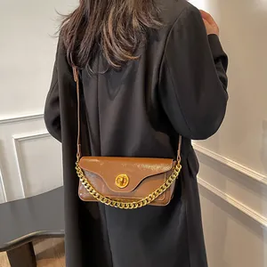 Retro dark brown glossy leather underarm bag with thick gold chain and shoulder strap