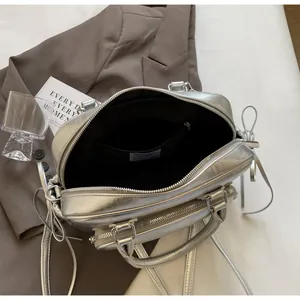 Detail view of silver bowling bag interior with black lining and inner zipper pocket
