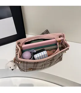 Top view of spacious pink plaid tote bag showing large interior storage and chain strap