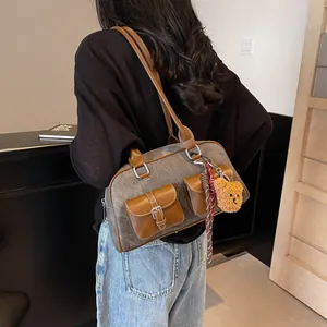 Vintage Boston canvas and leather shoulder bag with a teddy bear charm and side pockets
