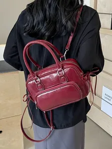 Minimalist deep red glossy leather crossbody bag with bow drawstring decoration