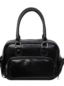 Minimalist black PU leather backpack with silver hardware and vintage motorcycle style