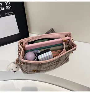 Top view of plaid tote bag interior showing large capacity for tablet and accessories