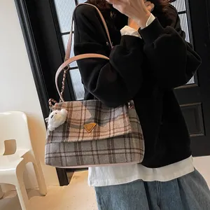 Winter plaid tote bag in brown and grey wool with pink leather strap and plush charm
