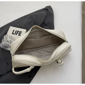 Spacious beige baguette bag interior with smooth PU leather finish and inner zipper pocket