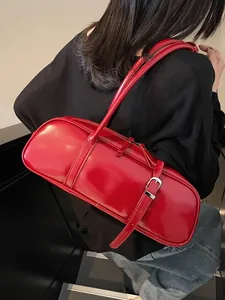 Chic red faux leather baguette bag with silver buckles and spacious interior for women
