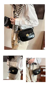 Close-up of black crocodile pattern saddle bag with golden buckle and horse charm