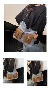 Detail of vintage canvas tote with brown leather pockets and a plush bear charm accessory