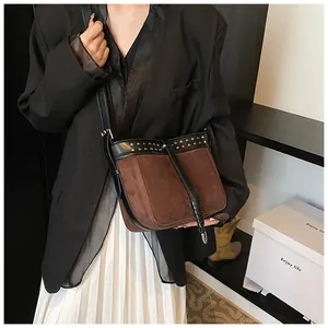 Retro contrast messenger bag with silver rivets shown on model for daily style