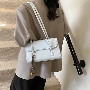 Fashionable light blue large capacity underarm shoulder bag with decorative charms for women
