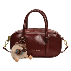 Vintage dark red Boston square handbag in glossy PU leather with bear charm and strap