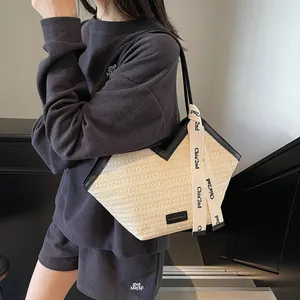 Chic woven tote bag with black leather trim and handles for summer casual commuting