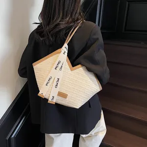 Fashion straw tote bag with V-cut design and brown leather trim for summer casual look