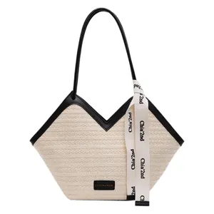 Retro cream straw tote bag with black leather trim and elegant ribbon handle