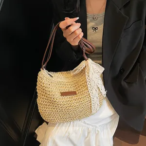 Straw bucket crossbody bag with lace bow and leather strap for summer beach vacation