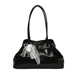 Stylish black glossy leather tote bag with lace pearl bow charm for women's daily commute