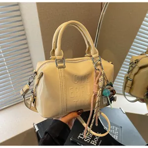 Beige retro Boston handbag with Cheerful Time embossed letters and trendy pendants