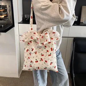 Floral cherry print mesh tote bag with ruffle trim and shoulder straps for women