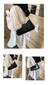 Detailed views of a black glossy leather shoulder bag with a stylish bow decoration