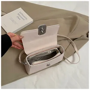 Detailed internal view of soft pink PU leather bag with multi-compartment storage space