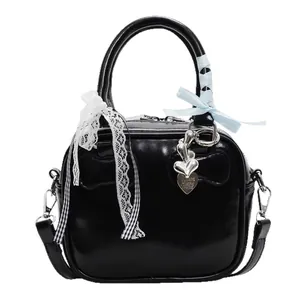 Chic black patent bowling handbag with lace ribbons and heart charm crossbody bag