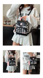 Detail view of mini checkerboard backpack featuring pink accents and a drawstring closure