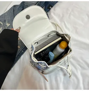 Interior view of blue checkered backpack showing storage capacity for daily essentials