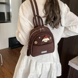 Cute brown suede backpack for women with cartoon puppy patch and wooden buttons