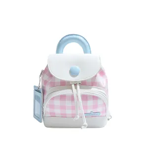 Pink and white checkered mini backpack with blue accents and matching card holder charm