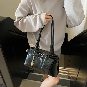 Fashionable black glossy underarm bag with silver buckle and mini pouch accessory