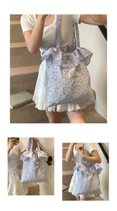 Detail of lavender floral tote bag featuring bubble textured fabric and ruffle edges