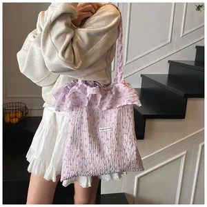 Floral purple tote bag with ruffle edge and bubble texture shown on a stylish model