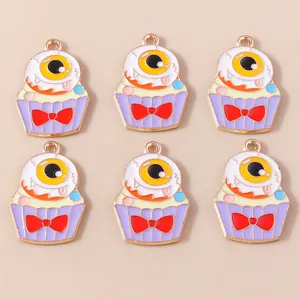 Detail of 6 purple eyeball cake charms with red bows for Halloween jewelry DIY