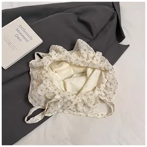 Detail view of the floral tote bag's spacious interior with a secure metal zipper pocket