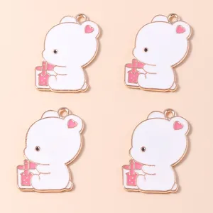 Set of four cartoon bear pendants with pink drinks and golden plating for DIY jewelry