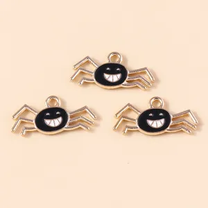 Spooky black enamel spider charms with gold plating and smile design for Halloween DIY crafts