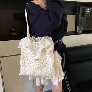 White floral canvas tote bag with ruffle trim and large capacity for summer fashion