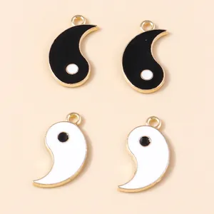 Set of four yin yang alloy charms with gold edges for DIY jewelry making and pendants