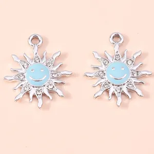 Detail view of silver sunflower smiley charms with blue enamel and sparkling rhinestones